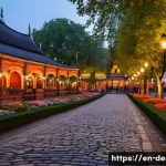 티볼리 공원 관광 정보 - A twilight scene inside Tivoli Gardens showcasing historic 19th-century architecture with intricate ...