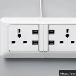 덴마크 전기 플러그 및 사용법 - A detailed close-up of Denmark&rsquo;s Type E and Type K power sockets on a wall, showing two round pins w...